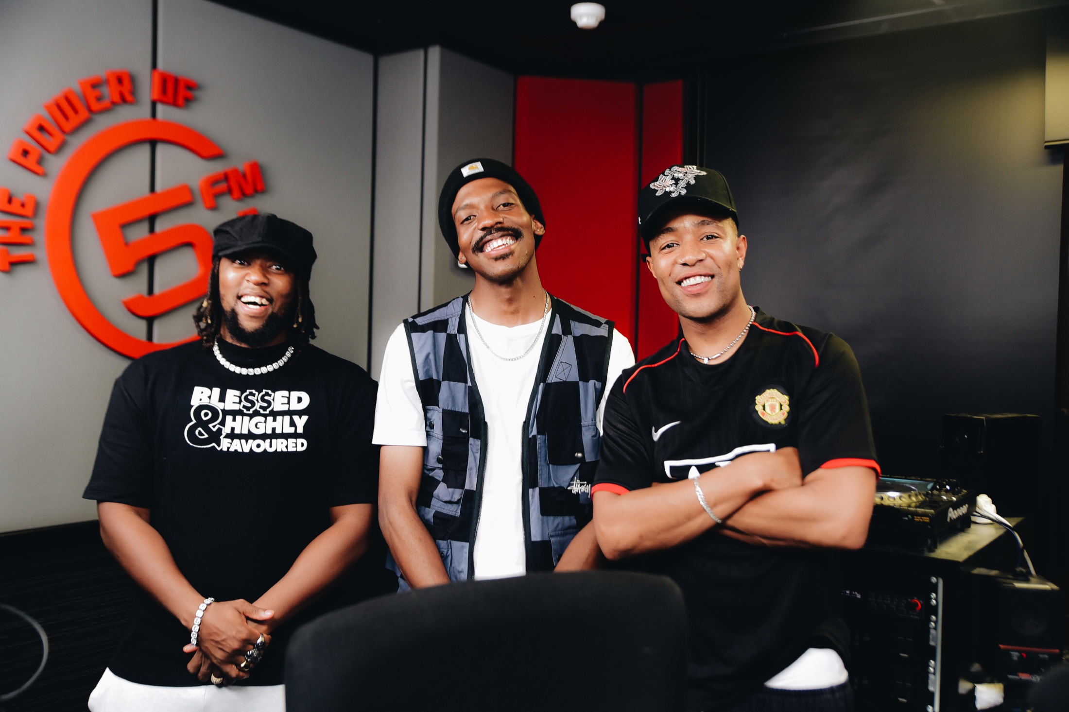 DOOM IT in studio at 5FM with two other guests laughing.